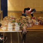 Volunteer preparing the food for delivery